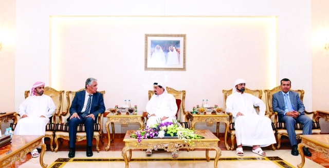 "■ حميد النعيمي بحضور عمار النعيمي خلال استقبال السفير اليمني  |  وام"