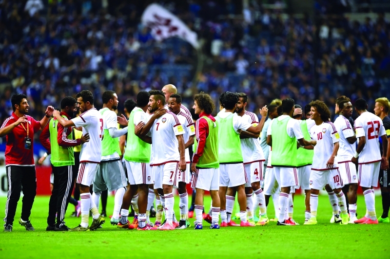 "■ فرحة لاعبي الأبيض بالفوز على المنتخب الياباني | أ ب"