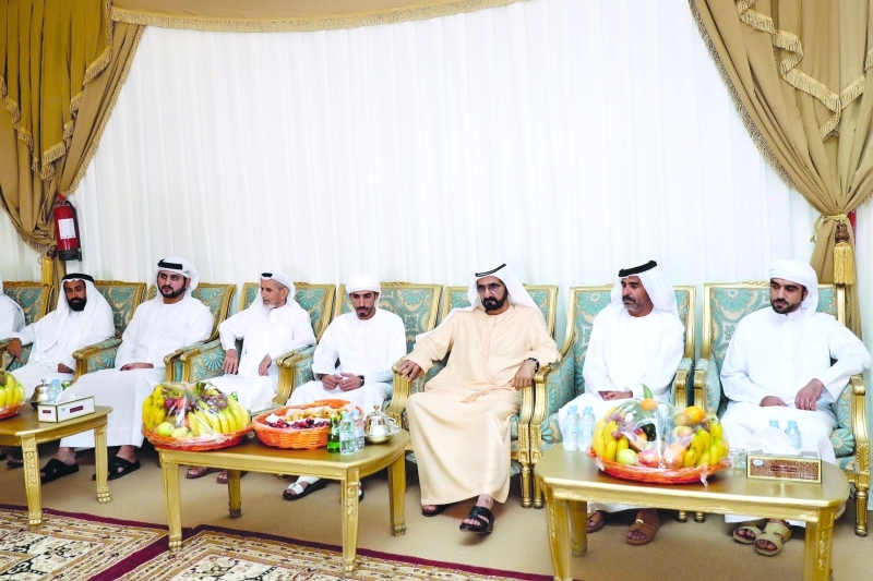 "■ محمد بن راشد يرافقه مكتوم بن محمد خلال تقديم العزاء في وفاة أحمد الفلاسي   |  تصوير: خليفة عيسى"