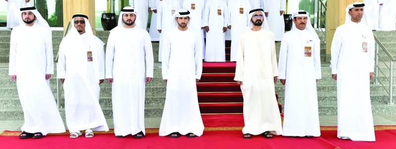 "سموه لدى افتتاحه المبنى الجديد لجهاز أمن الدولة يرافقه حمدان ومكتوم وأحمد بن محمد وضاحي خلفان ومحمد القمزي | تصوير - البيان"