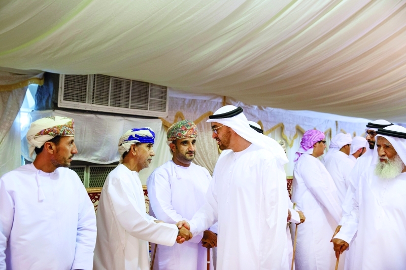 "■ محمد بن زايد خلال تقديم العزاء إلى حمود الشامسي وإخوانه في وفاة والدهم يرافقه طحنون بن محمد وهزاع بن طحنون | وام"