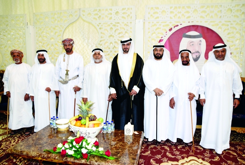 "العريس طارق البادي مع عدد من كبار الحضور"