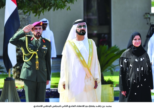 "■ محمد بن راشد خلال عزف السلام الوطني بحضور أمل القبيسي قبيل افتتاح انعقاد المجلس"