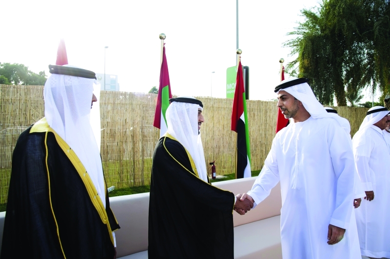 "■ عمر بن زايد يهنىء العرسان"