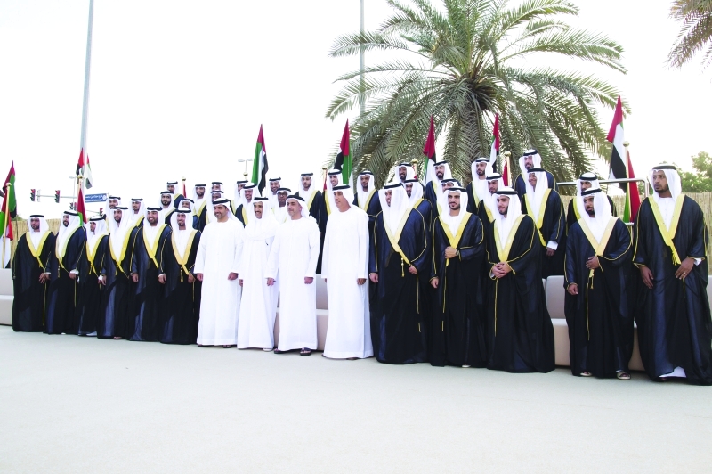 "■ سيف وحامد بن زايد مع العرسان"