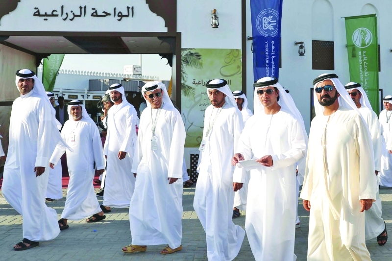 "■ نائب رئيس الدولة خلال الجولة في موقع المهرجان يرافقه هزاع بن زايد"