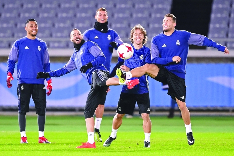 "■ جانب من تحضيرات ريال مدريد لمباراة أميركا كلوب | أ ف ب"