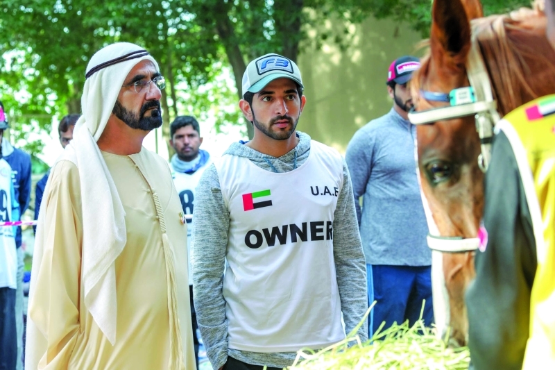 "■ محمد بن راشد وحمدان بن محمد خلال متابعة السباق | تصوير: علي عيسى"