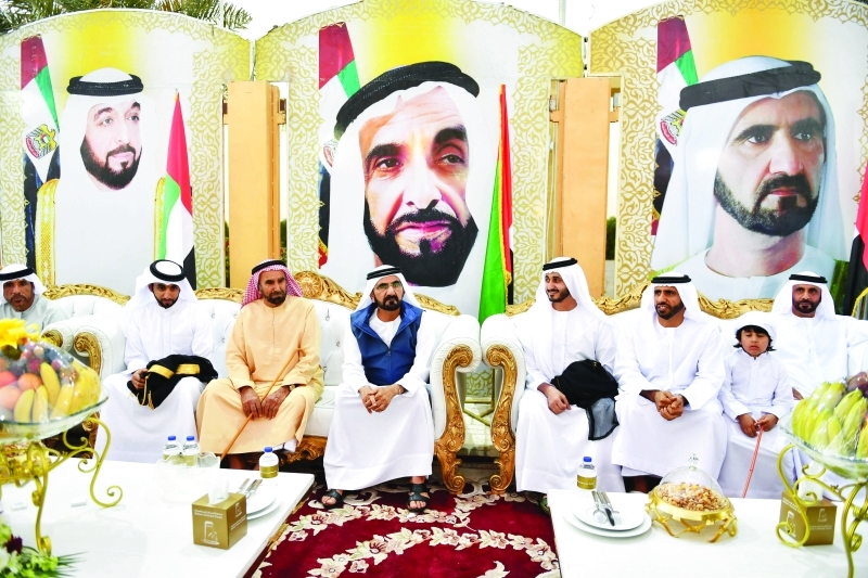 "■ سموه وأحمد بن حميدان والعريس والحضور"