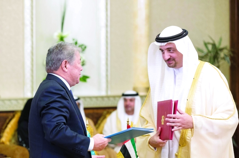 "خالد العلي وأحمتجان إسيموف عقب توقيع مذكرة التفاهم"