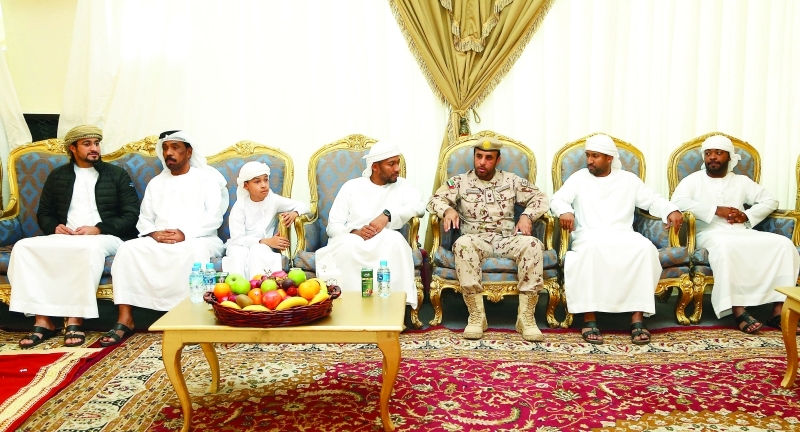 "خلال تقديم واجب العزاء لذوي الشهيد"