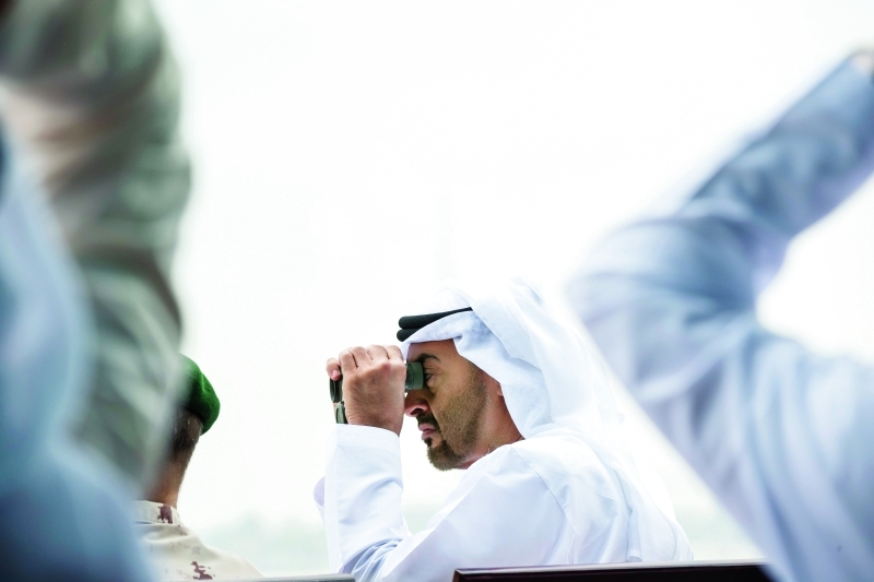 "محمد بن زايد خلال متابعة العرض العسكري الحي | وام"
