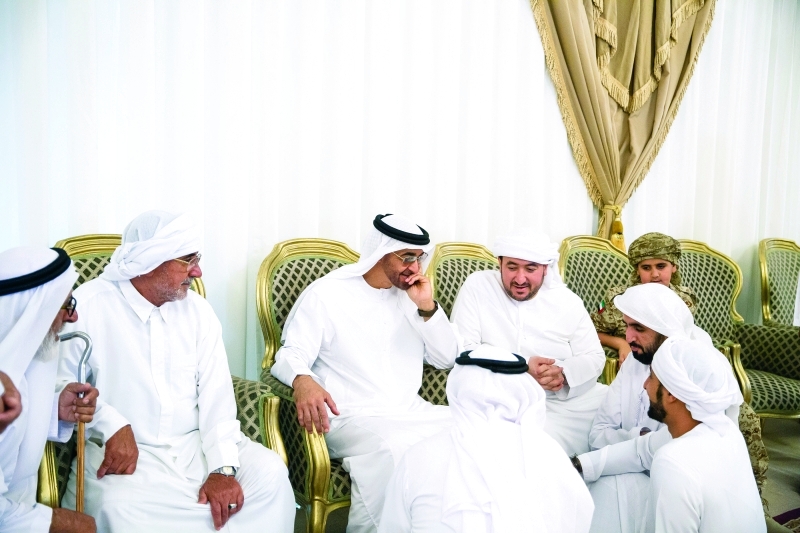 "■ سموه يتحدث إلى ذوي الشهيد حسن البشر"