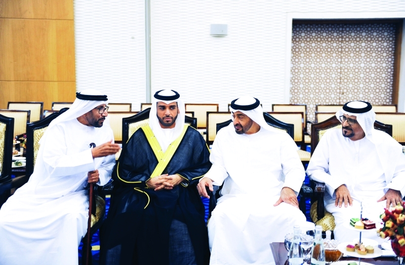 "■ سموه مع العريس وجانب من الحضور"