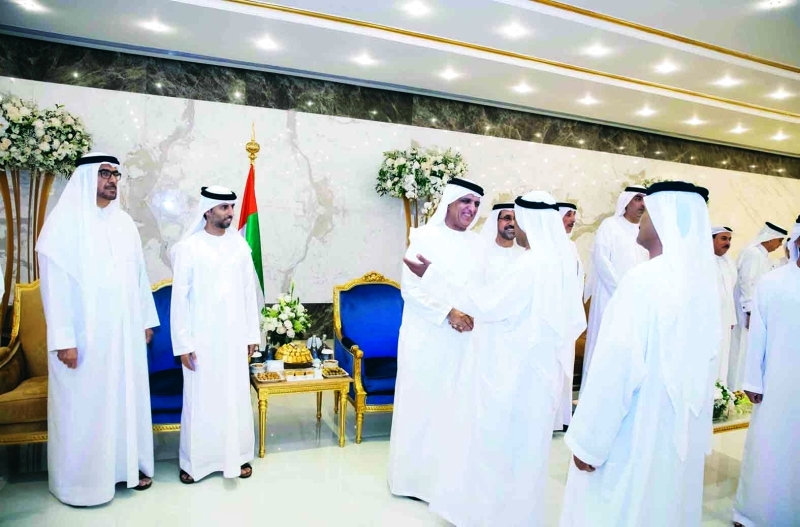 "■ سعود بن صقر لدى استقبال المهنئين بحضور سهيل المزروعي"