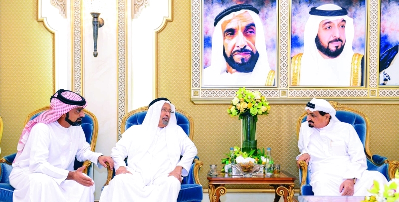 "■ حميد النعيمي خلال استقباله راشد عبد الله بحضور عمار بن حميد   |   وام"