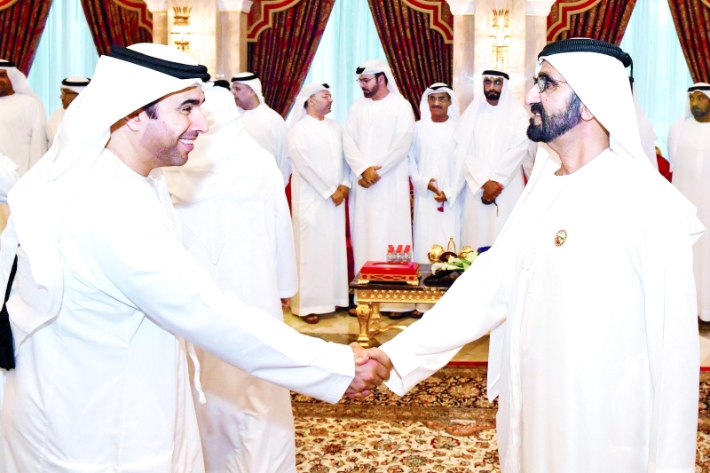 ".. ومصافحاً أحمد الريسي"