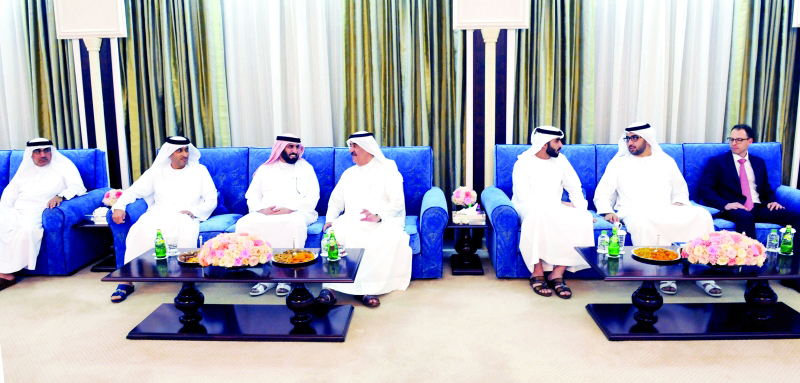 "■ سعود المعلا خلال استقباله المهنئين بحضور راشد بن سعود"