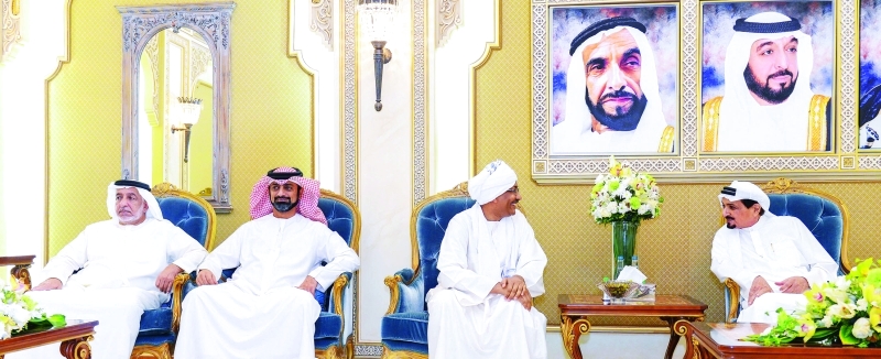 "■ حاكم عجمان وعمار النعيمي خلال استقبال المهنئين  |  وام"