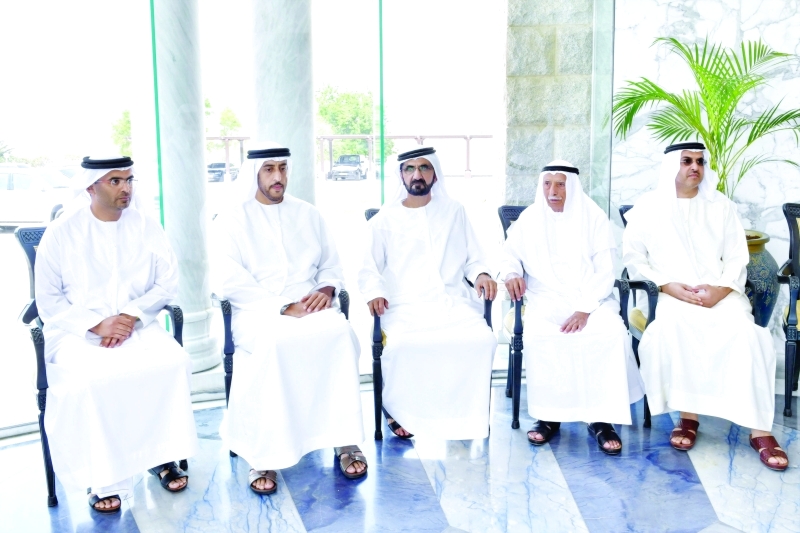 "■ محمد بن راشد خلال تقديم العزاء إلى جمعة الماجد بحضور عبدالله المعلا | تصوير ـ سيف محمد"