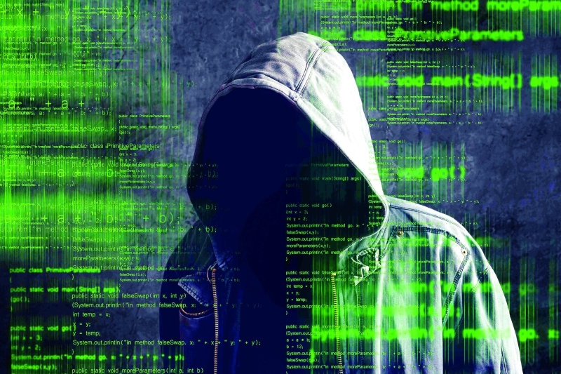 "Faceless hooded anonymous computer hacker"