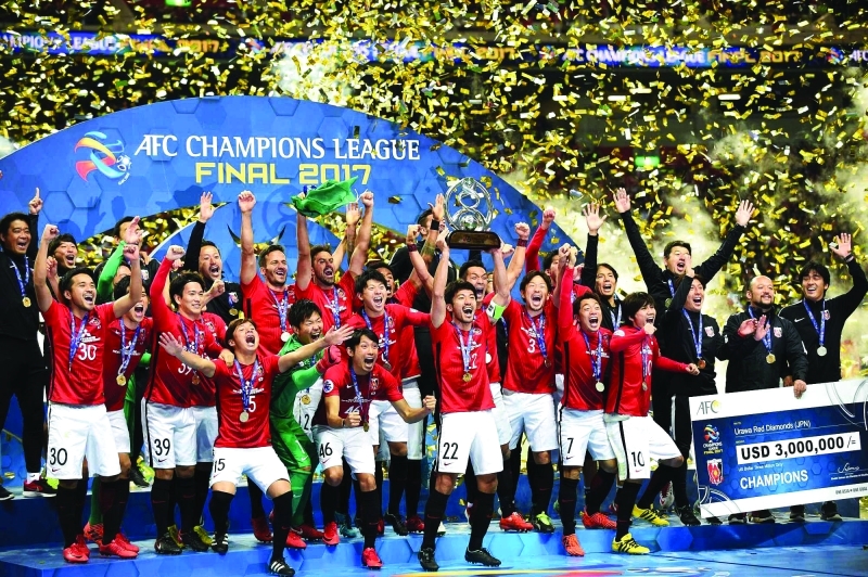 "■ لاعبو أوراوا ريدز يحتفلون بالتتويج بلقب دوري أبطال آسيا | أرشيفية"