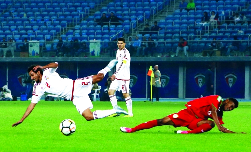"Emirates' Mohammad Saleh vies for the ball with Oman's Raed Saleh (R) during their 2017 Gulf Cup of Nations football match between UAE and Oman at the Sheikh Jaber al-Ahmad Stadium in Kuwait City on December 22, 2017. / AFP / Yasser Al-Zayyat"