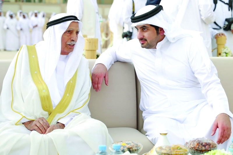 "أحمد بن محمد وجمعة الماجد خلال الحفل"