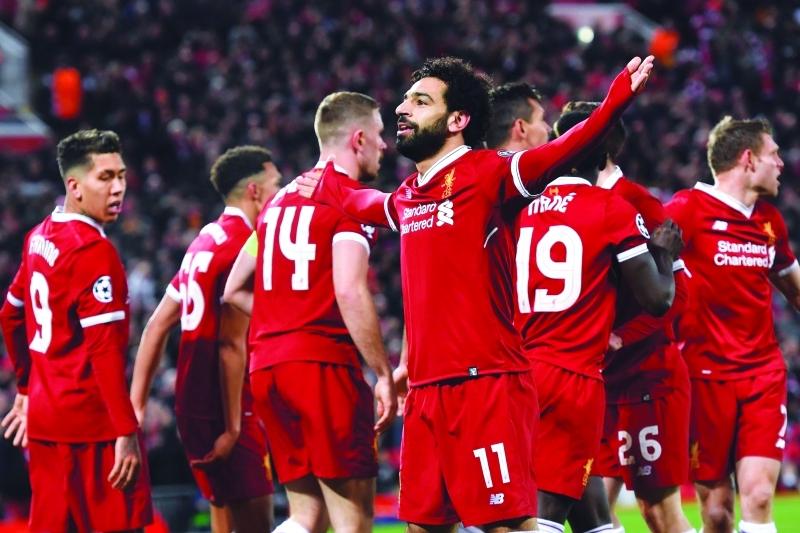 "Ⅶ محمد صلاح يحتفل مع لاعبي ليفربول بالهدف الأول في مرمى سيتي | أ ف ب"
