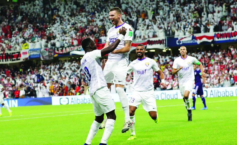 "epa07238765 Players of Al Ain FC celebrate a goal during the FIFA Club World Cup 2018 semi-final match between Al Ain FC and River Plate in Al Ain, United Arab Emirates, 18 December 2018. EPA/MAHMOUD KHALED"