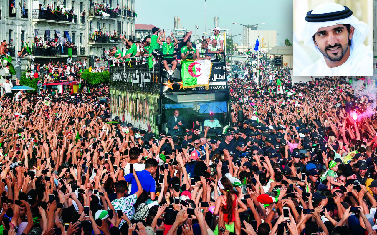 "الجماهير الجزائرية تحتفل بإنجاز محاربي الصحراء | ا ف ب"