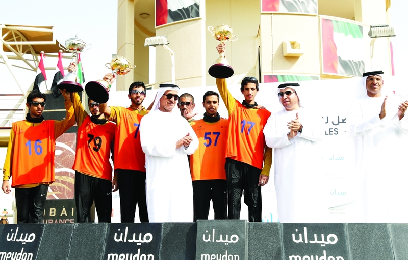 "أحمد الريسي وغانم الهاجري ومحمد العضب خلال تتويج الأبطال | تصوير - دينيس ملاري"