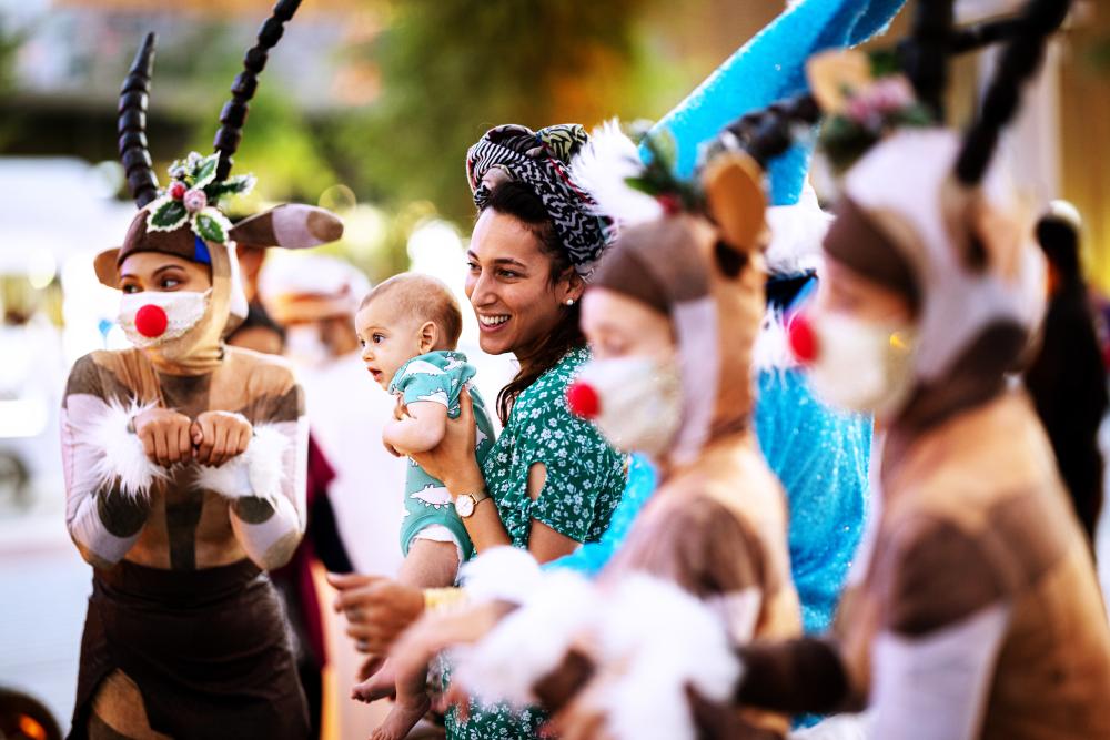 "DUBAI, 15 December 2021. Visitors with Christmas performers at Expo 2020, Expo 2020 Dubai. (Photo by Walaa Alshaer/Expo 2020 Dubai)"