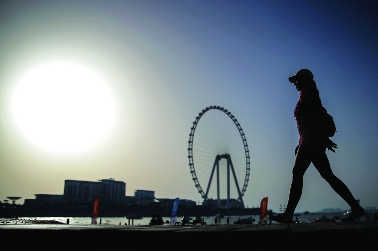 "epa09985039 People make the most of the day in Dubai, United Arab Emirates, 29 May 2022. The Dubai government's tourism authority in May 2022 reported a total of 3.97 million international visitors for the first quarter of 2022, more than three times the number of 1.27 million for the same time span in the previous year. EPA/ALI HAIDER"