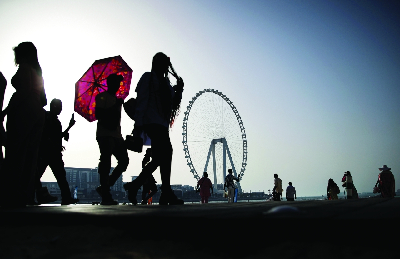 "epa09985035 People make the most of the day in Dubai, United Arab Emirates, 29 May 2022. The Dubai government's tourism authority in May 2022 reported a total of 3.97 million international visitors for the first quarter of 2022, more than three times the number of 1.27 million for the same time span in the previous year. EPA/ALI HAIDER"