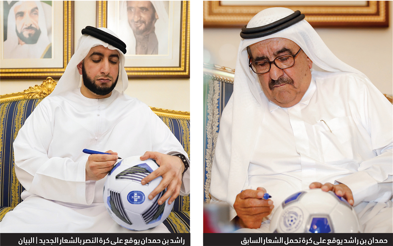 "حمدان بن راشد يوقع على كرة تحمل الشعار السابق"