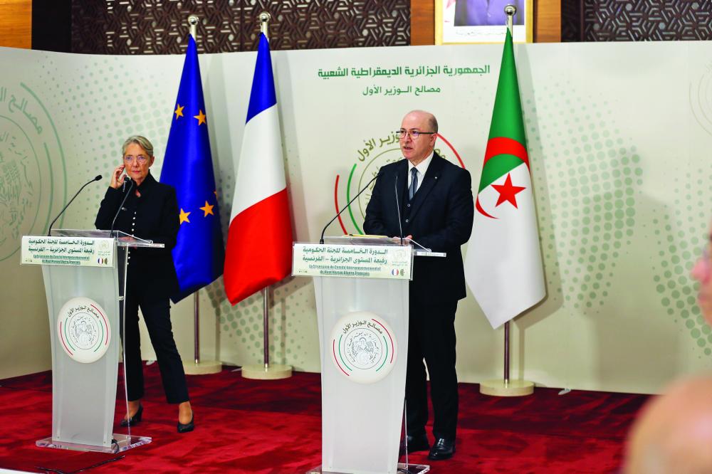 "French Prime Minister Elisabeth Borne, left, and Algerian Prime Minister Aimene Benabderrahmane attend the 5th High Level Intergovernmental Committee between Algeria and France, in Algiers, Algeria, Monday, Oct. 10, 2022. (AP Photo/Fateh Guidoum)"