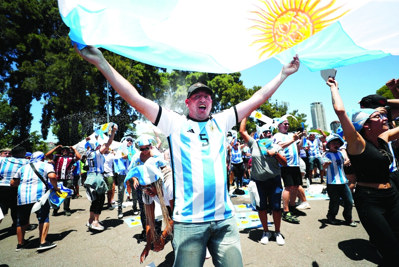 "Soccer Football - FIFA World Cup Final Qatar 2022 - Fans in Buenos Aires watch Argentina v France - Buenos Aires, Argentina - December 18, 2022  Argentina fan celebrates their second goal scored by Angel Di Maria REUTERS/Agustin Marcarian"