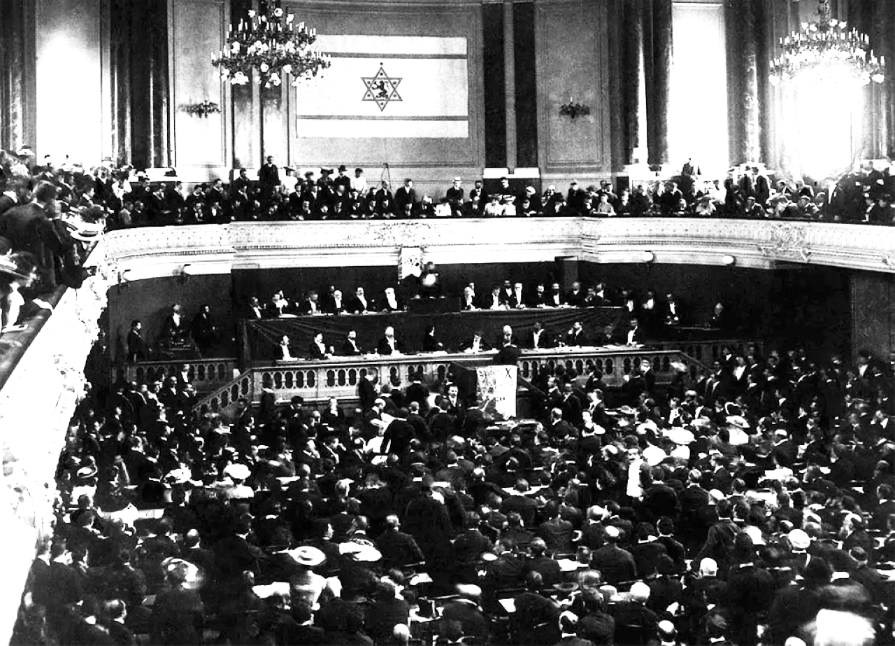 "1903 المؤتمر الصهيوني الـ 6 في بازل ينتهي بانشقاق حول تأسيس وطن قومي لليهود في أوغندا."