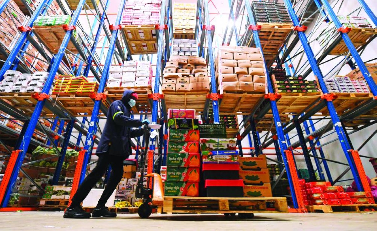 A cooled fruit and vegetable warehouse is pictured in Dubai on July 21, 2020. - Dubai, like the other six emirates that make up the UAE, is heavily dependent on imports, which make up 90 percent of its food needs according to official statistics. Produce arrives from all over the world by air and at Dubai's state-of-the-art port, stocking supermarkets with a range that compares favourably to those of any Western capital. (Photo by Karim SAHIB / AFP)