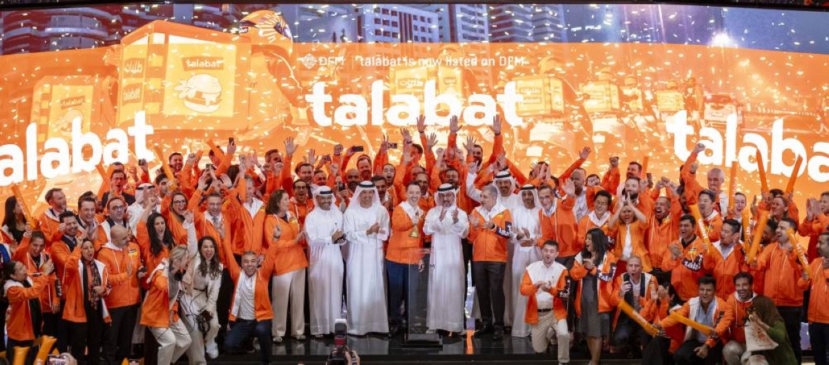 هلال المري وحامد علي وتوماسو رودريجز والحضور خلال قرع جرس التداول