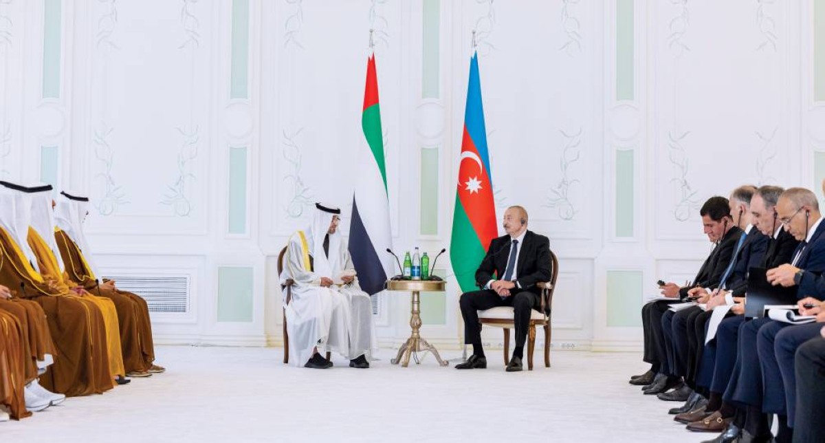 محمد بن زايد وإلهام علييف خلال اللقاء 
