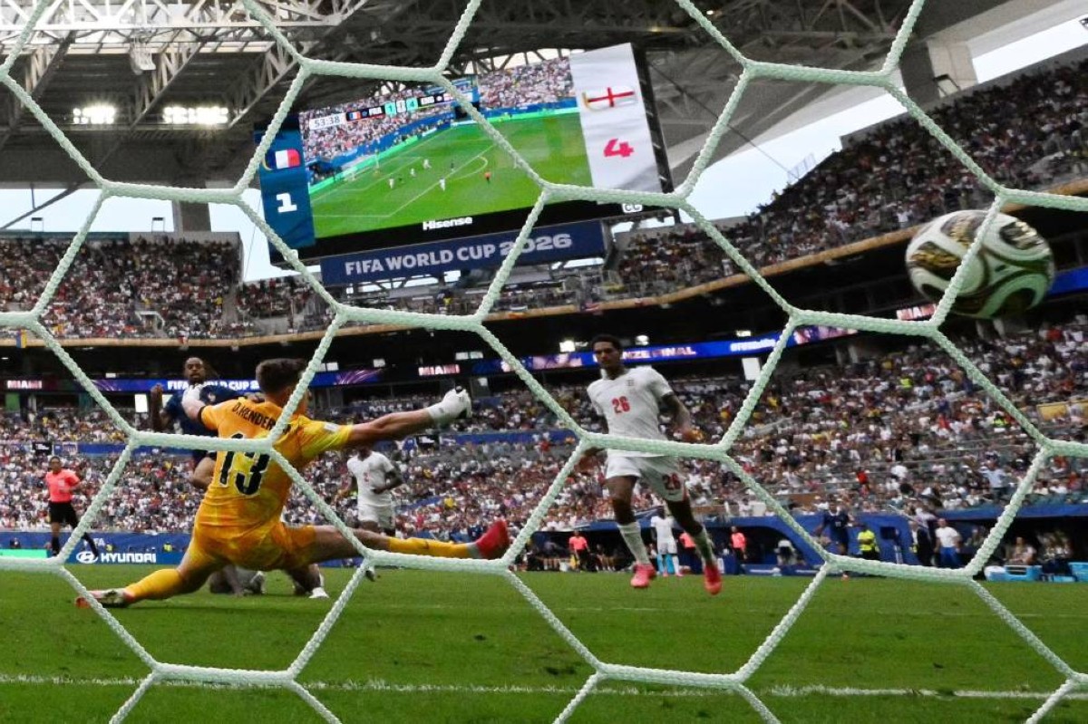 England's goalkeeper #13 Dean Henderson concedes a goal scored by France's forward #12 Bradley Barcola and his team's second goal during the 2026 World Cup football tournament third-place match between France and England at the Miami Stadium in Miami on July 18, 2026. (Photo by CHANDAN KHANNA / AFP)