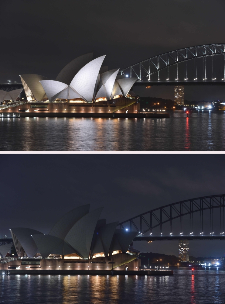 الصورة : جسر سيدني ودار الأوبرا قبل الاحتفال بساعة الأرض في العاصمة الاسترالية / أ.ف.ب