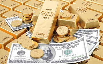 الصورة: الصورة: الذهب يرتفع.. والدولار إلى أدنى مستوى في شهر