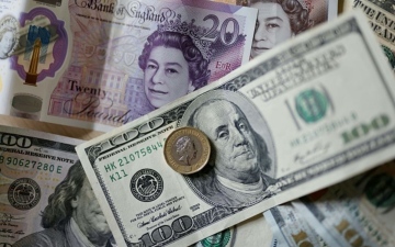 الصورة: الصورة: الدولار يرتفع والإسترليني قرب أعلى مستوياته في عام