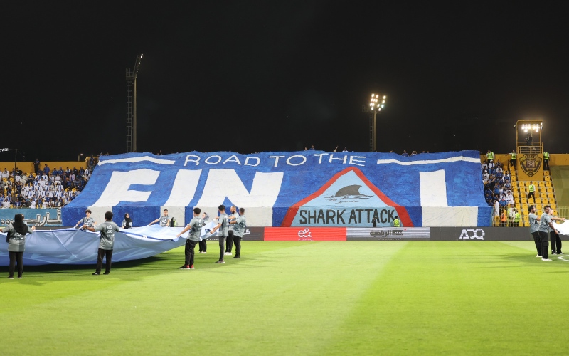الصورة: الصورة: لا تقترب من "القرش الأزرق".."تيفو" مدهش لجمهور النصر يزين مدرجات (فيديو)